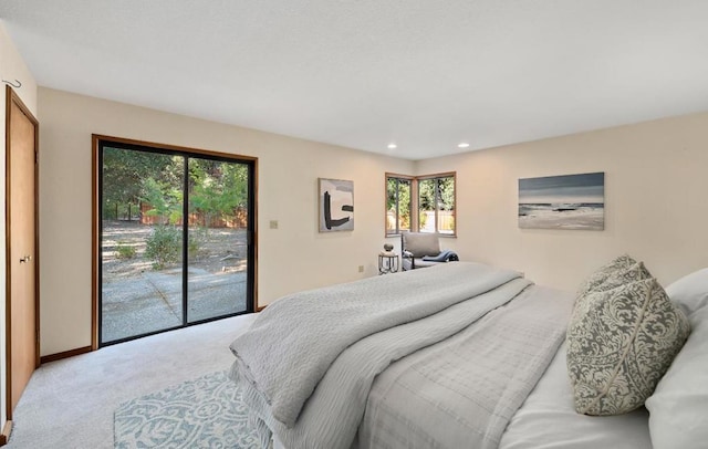 bedroom with access to outside and carpet flooring