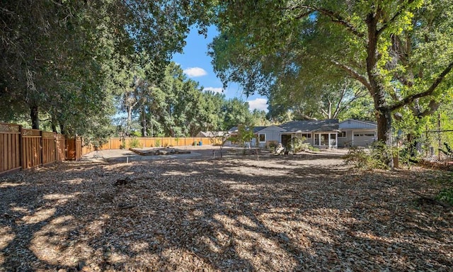 view of yard featuring a garage