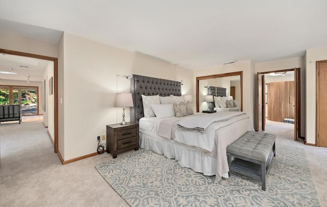 bedroom with light colored carpet and a closet