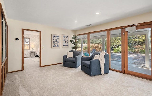 carpeted living room featuring plenty of natural light