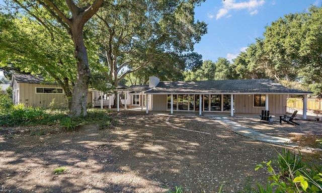 rear view of property featuring a patio area