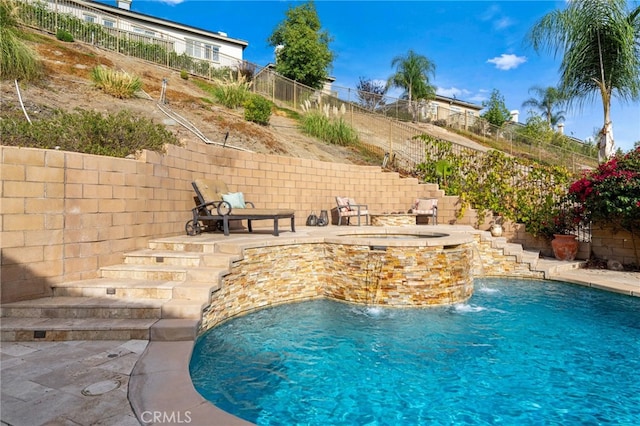 view of swimming pool featuring pool water feature