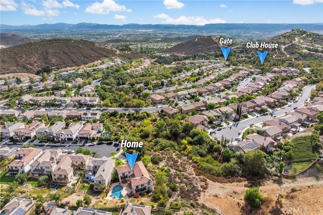 birds eye view of property with a residential view and a mountain view