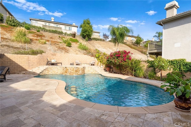 view of pool featuring a patio area, a fenced backyard, and a fenced in pool