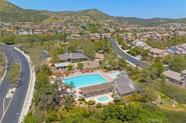 birds eye view of property with a mountain view