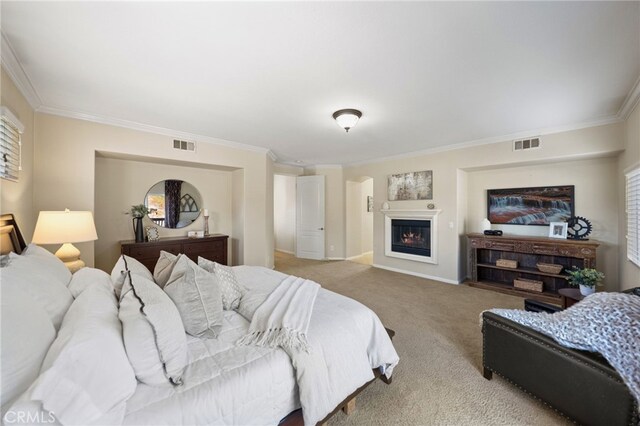 bedroom with light colored carpet and ornamental molding