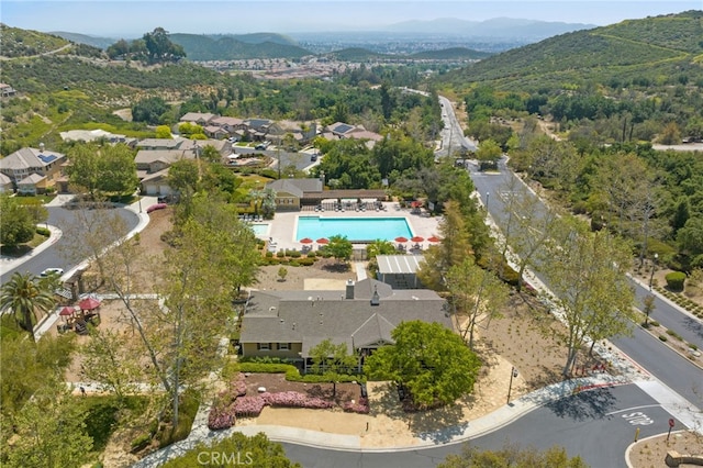 bird's eye view with a mountain view and a wooded view