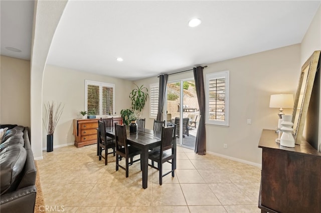 dining area featuring light tile patterned floors, recessed lighting, and baseboards