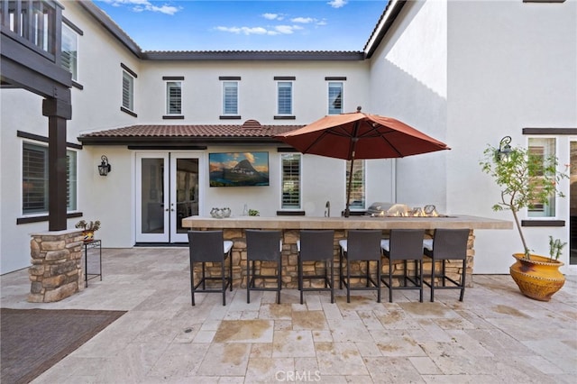 view of patio / terrace featuring a wet bar