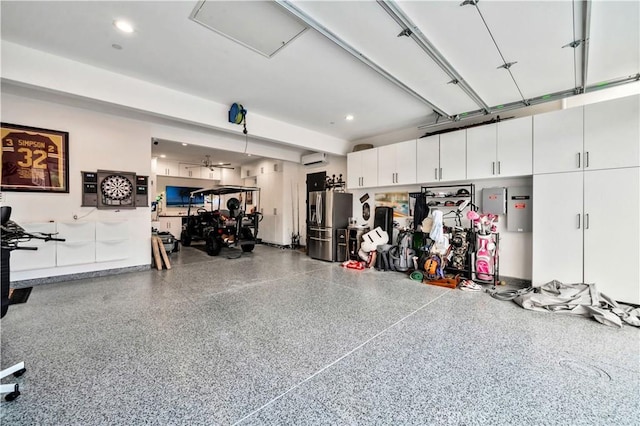 garage featuring stainless steel refrigerator with ice dispenser