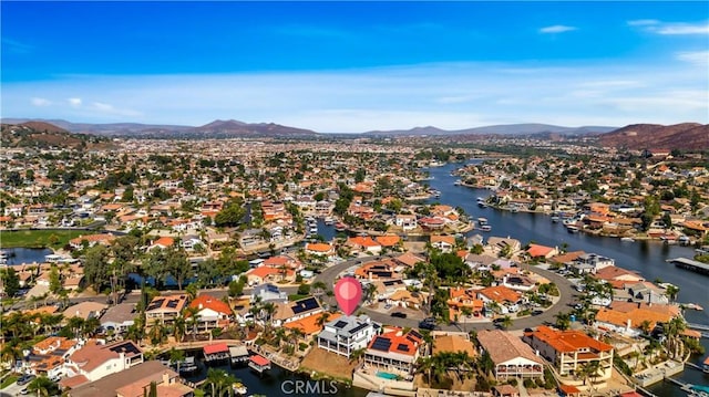 birds eye view of property with a residential view and a water and mountain view