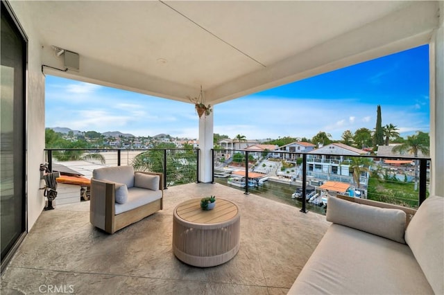 view of patio with a balcony and an outdoor hangout area