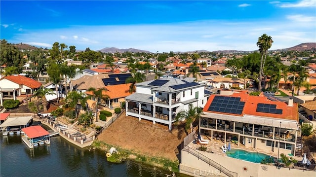 bird's eye view featuring a residential view and a water and mountain view