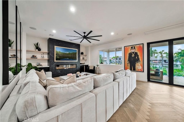 living area featuring recessed lighting and a ceiling fan