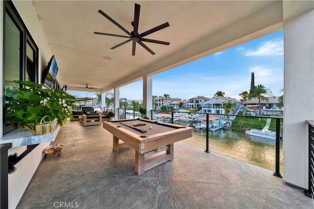 view of patio / terrace featuring a residential view and ceiling fan