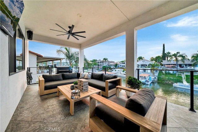 view of patio with an outdoor living space and ceiling fan