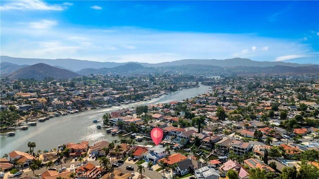 bird's eye view with a residential view and a water and mountain view