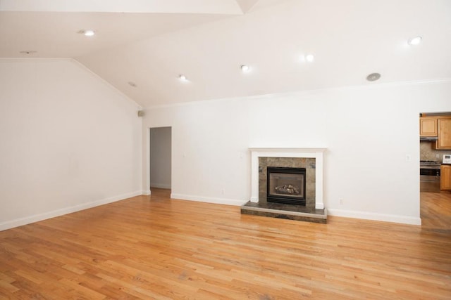 unfurnished living room with a fireplace, light hardwood / wood-style flooring, high vaulted ceiling, and ornamental molding