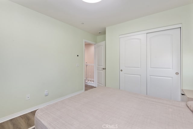 bedroom with a closet and wood-type flooring