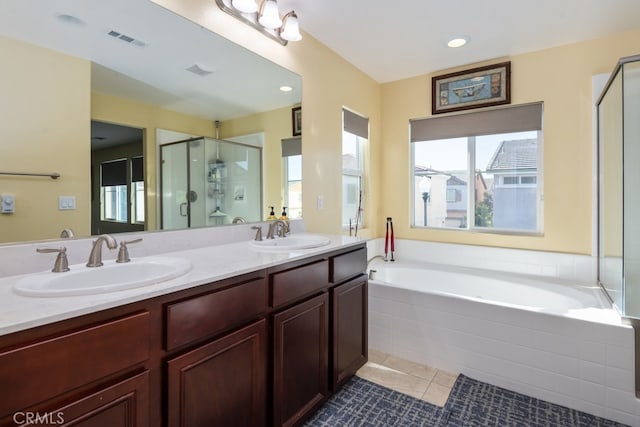 bathroom with vanity, tile patterned floors, and independent shower and bath