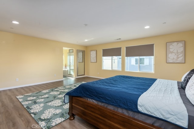 bedroom with hardwood / wood-style floors