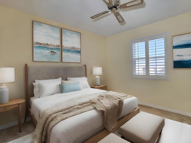 bedroom with ceiling fan and light colored carpet