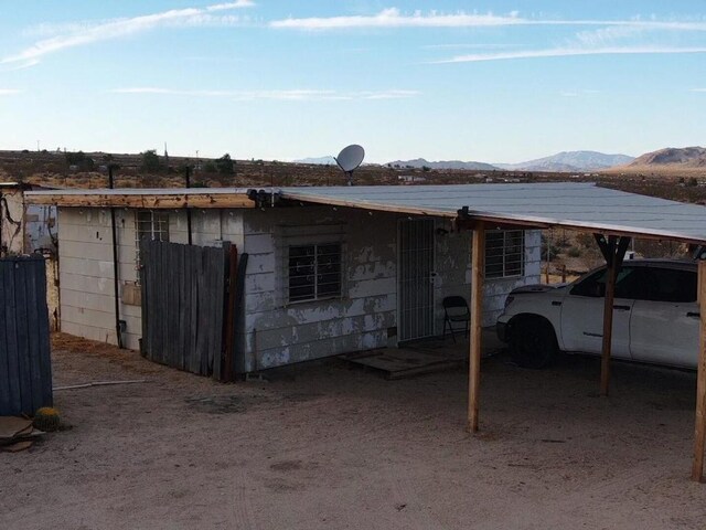 back of property featuring a mountain view