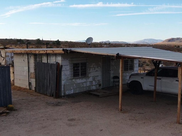 back of property featuring a mountain view