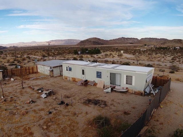 back of property featuring a mountain view