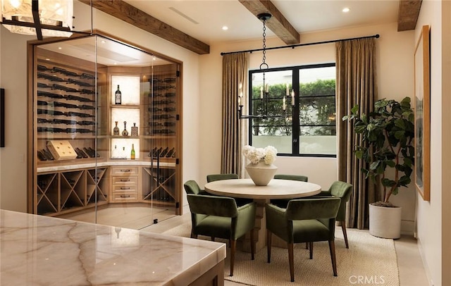 wine area with beamed ceiling and light tile patterned floors