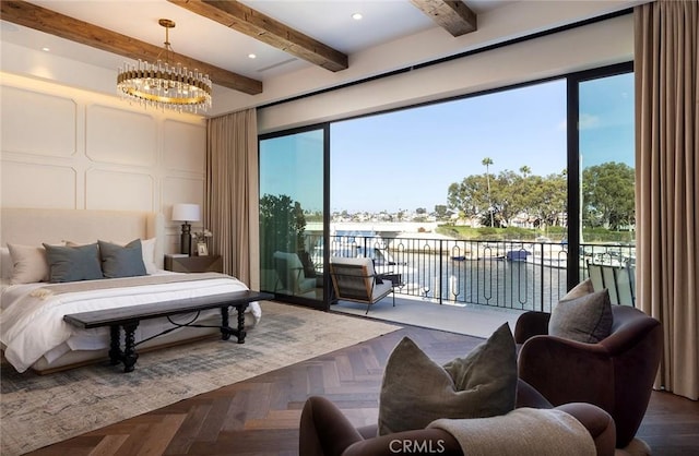 bedroom with access to outside, an inviting chandelier, dark parquet floors, a water view, and beam ceiling