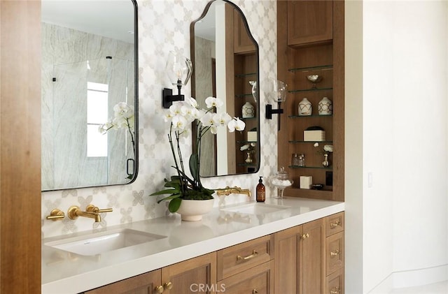 bathroom featuring vanity and a shower with shower door