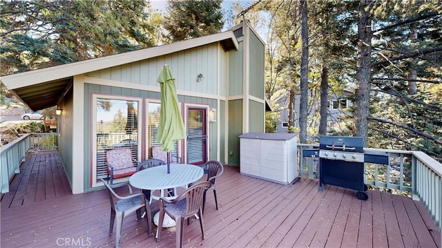 wooden deck featuring area for grilling