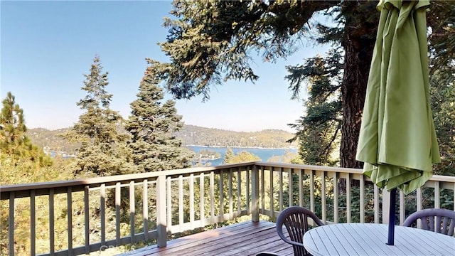 deck featuring a water and mountain view