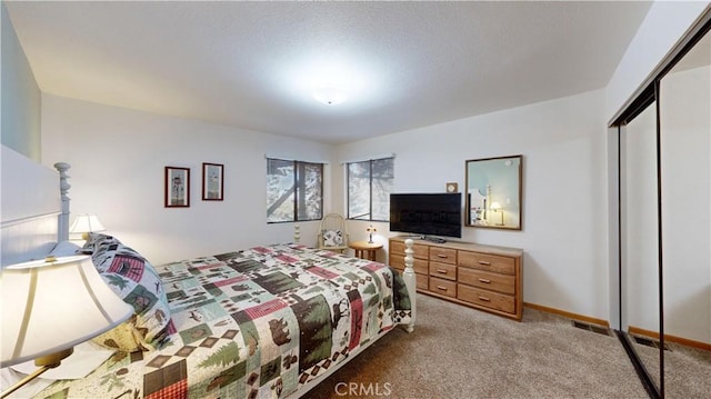 bedroom featuring light colored carpet and a closet