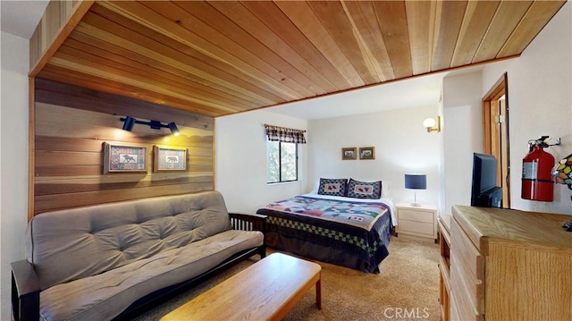 bedroom with light colored carpet and wooden ceiling