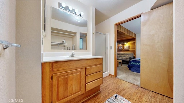 bathroom with vanity and hardwood / wood-style flooring