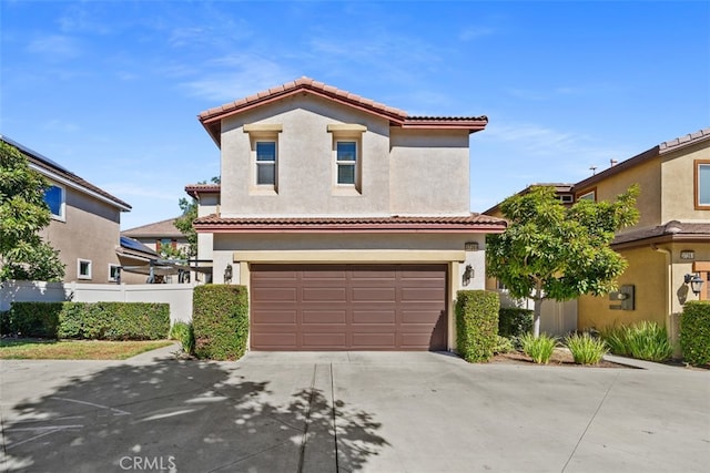 mediterranean / spanish-style house featuring a garage