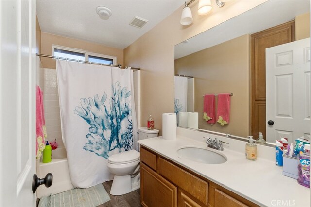 full bathroom featuring vanity, shower / bath combination with curtain, wood-type flooring, and toilet