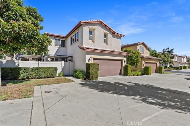 mediterranean / spanish house featuring a garage