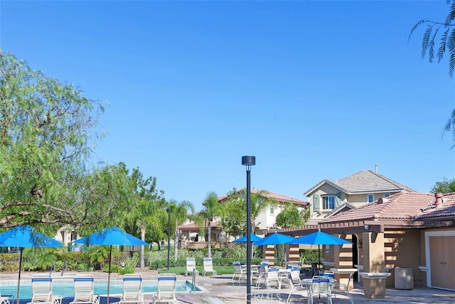 exterior space with a patio area and a pool