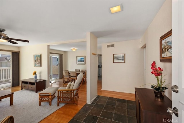 interior space featuring dark hardwood / wood-style floors and ceiling fan