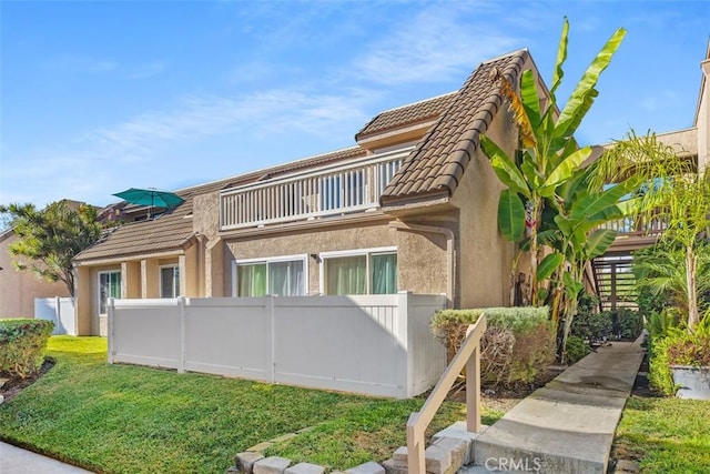 view of property exterior with a balcony