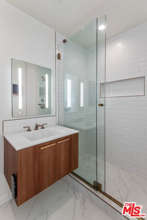 bathroom featuring vanity and walk in shower