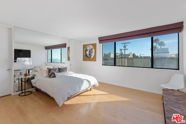 bedroom with light wood-type flooring