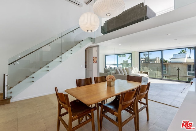 dining area featuring light tile patterned flooring