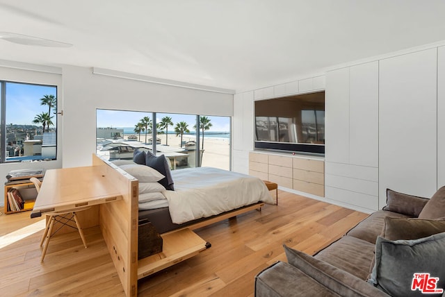 bedroom with light wood-type flooring