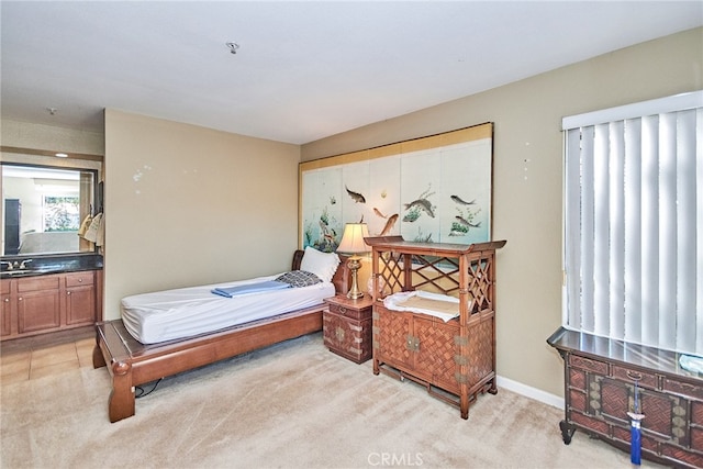 carpeted bedroom featuring sink