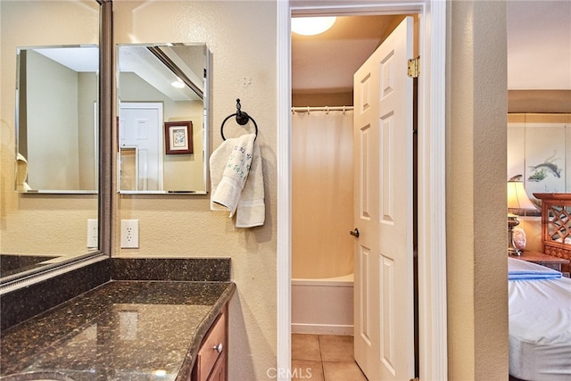 bathroom featuring vanity, a shower with shower curtain, and tile patterned flooring