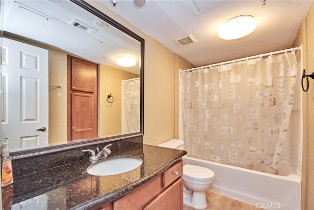 full bathroom with vanity, toilet, tile patterned floors, and shower / bath combo